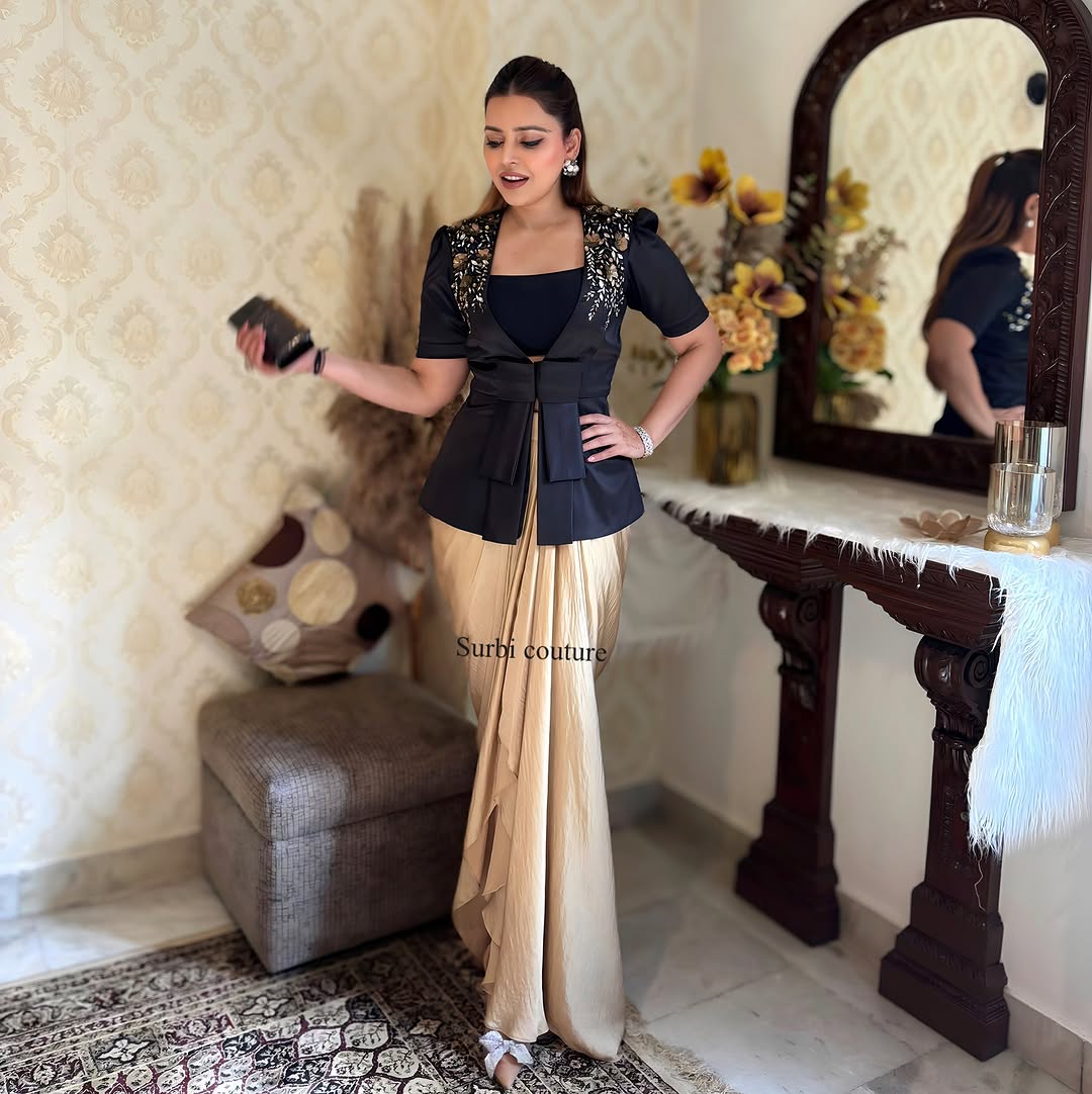Embroidered jacket teamed up with a draped skirt