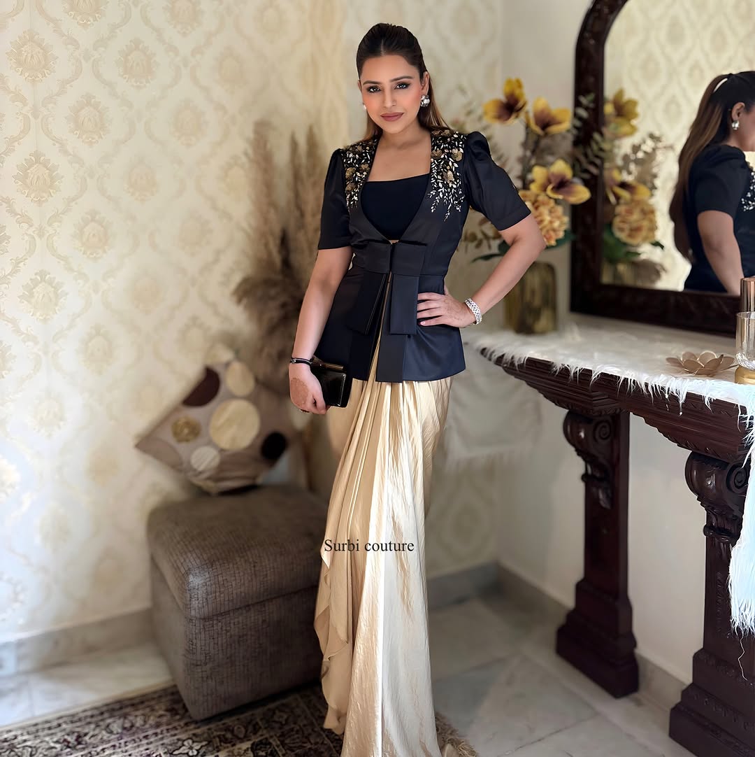Embroidered jacket teamed up with a draped skirt