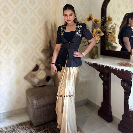 Embroidered jacket teamed up with a draped skirt